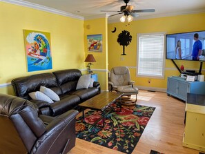 Family Room w/ 65" TV and couch and chairs that all recline!