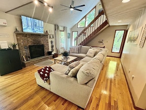 Large comfy sofa for gathering in front of the fireplace.