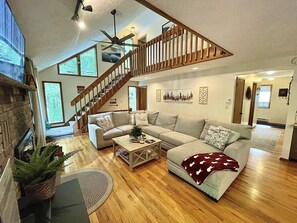 Large comfy sofa for gathering in front of the fireplace. 