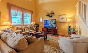Great room with sofa sleeper, Blue Ray and 65" TV.