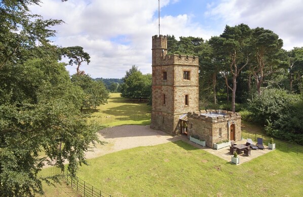 The Knoll Tower, built circa 1865, is located in the midst of the ancient and historic park of Weston Park, with panoramic views of the Shropshire countryside and Welsh borders