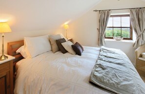 First floor: Bedroom one with a king-size bed