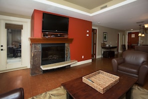 Cable TV and electric fireplace in the living room to keep you warm