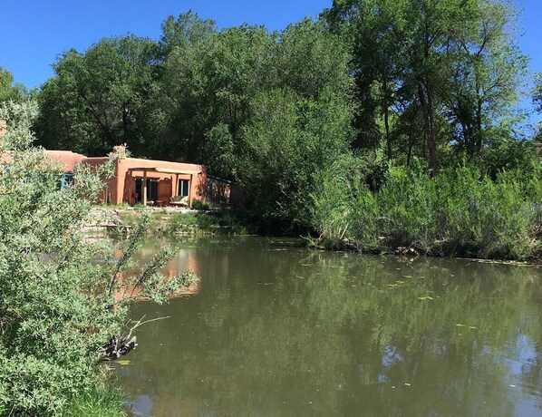 Adobe Casita on the half acre pond on our eco solar 8 acres of lush trails