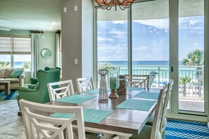 Dining room views with large window doors that open straight to the deck