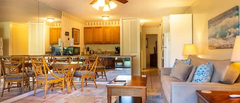 Living room opens to kitchen with washer/dryer