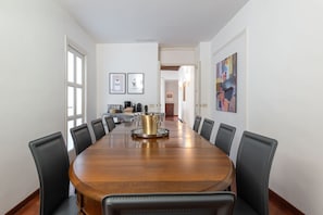 10 people dining room with a Nespresso machine and an American coffee brewer