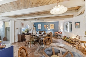 Dining area with some bonus seating with a view of the living room