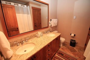 Remodeled master bathroom with granite counters