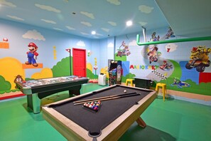 Games Room showing air hockey, pool table, multi-arcade, portable AC