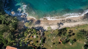 Aerial view of the semi-private beach in front of Flamingo Marina Cove 617