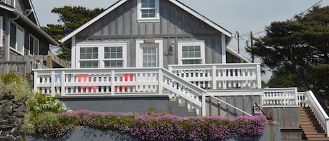 Front view of the cottage with the beach right across the street.