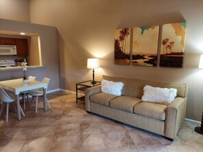 Living area with queen sofa sleeper, dining area