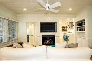 GAS LOG FIREPLACE AND 55-INCH CURVED TV