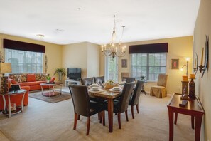 The Dining area  exudes rustic charm with its wooden furniture and inviting ambiance. With warm tones and natural textures, it offers a cozy setting where guests can gather for delicious meals and delightful conversations.