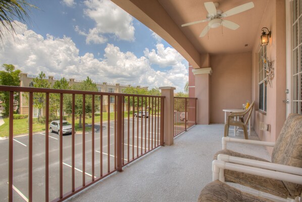 Step onto the balcony with outdoor sitting space , where guests are embraced by the charm of outdoor living amidst panoramic views and gentle breezes, creating the perfect setting for relaxation and memorable moments.