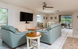  Family fun time - There’s plenty of room in the open-plan living/dining area for the whole family to gather together to watch TV, play a game, work on a jigsaw puzzle, and just enjoy each other’s company.