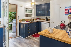 Kitchen - Beautifully renovated and supplied with everything you might need for creating a masterpiece.  BBQ just outside the kitchen door.