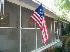 This screened in porch is perfect for mint julep summer nights or coffee mornings.