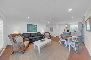 This open floor plan includes a comfortable living room. The living room has a lot of windows that let in a lot of natural light. The living room is a great place to relax and enjoy the view.