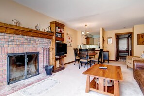 The living room looking towards the kitchen and dining table
