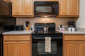 Elegant Kitchen of the Apartment in Orlando Florida - Flavors mingle, memories are made, and every dish tells a tale of delicious moments shared - Modern kitchen with sleek, stainless steel appliances - Smart use of space with versatile storage