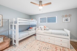 Interior - Charming second bedroom featuring twin over Twin bunk beds with a twin daybed designed for maximum comfort and space efficiency