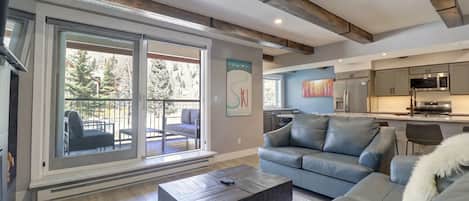 Nicely updated living area looking out to private balcony.