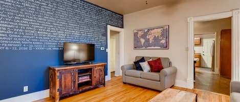 Living Room: wall of games history, queen sofa sleeper, flat screen TV