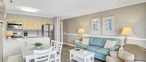 Living/dining area - Newly decorated unit.  Bright coastal colors with new flooring and furniture