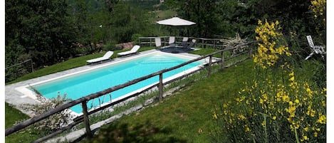 The pool area seen from the terrace overlooking it