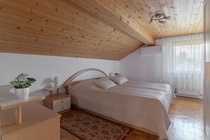 The air conditioned bedroom with a large  king size bed (180 x 200 cm).