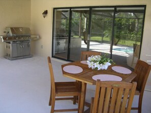Grill Area Pool Side / Outside from Fam rm