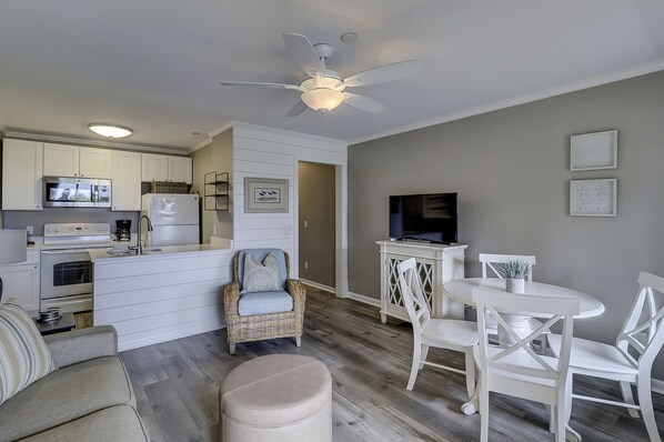 Living/Dining/Kitchen - This beautifully decorated Oceanfront villa has been totally renovated.
The dining table has seating for four.
The Living Room has designer furnishings and new wood grain tile flooring.
