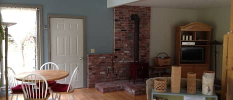 Looking into the dining & living room from bottom of the stairs.