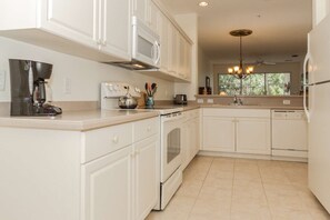 Full size kitchen and appliances, with a fantastic open eating bar makes entertaining easy and enjoyable.