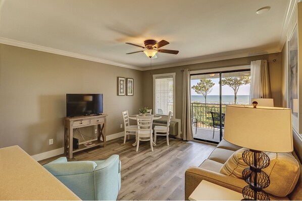 Living room/dining room - Beautifully renovated villa with living and dining combination.  Check out the view!