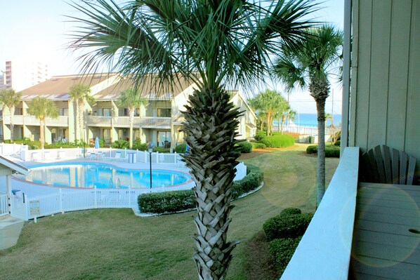 View from the deck of the pool and the gulf in the background.
