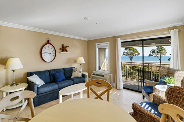 Living Room - Bright fresh furnishings make a pleasant environment for an oceanfront holiday. Tile flooring is throughout the entire condo.