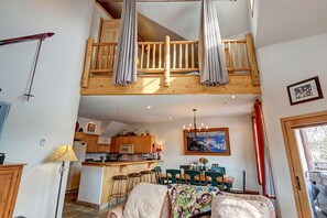 Living Room looking up into the loft/room