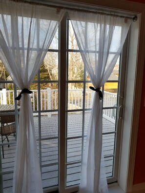 Sliding glass doors head to your own private deck.
