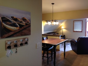 The entryway into Unit 6. A parking pass and extra key will be on the hooks.