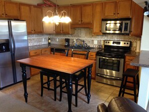 The kitchen is beautiful and very well stocked. 