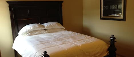 The master bedroom is spacious. The bed is maple and seriously comfortable. 