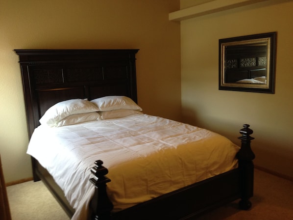 The master bedroom is spacious. The bed is maple and seriously comfortable.
