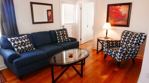Living room, view of door to balcony and bedroom