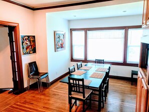 Dining room. Great sunlight. Table fits 6 easily, 10 if needed. Extra chairs. 