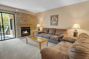 Cozy living area with gas fire for chilly seasons.