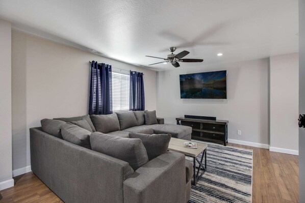 Sectional couch and 55" flat screen TV for when you want to cozy up for your favorite show
