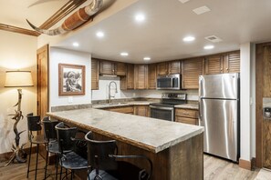 Kitchen with bar seating for 4 in 229